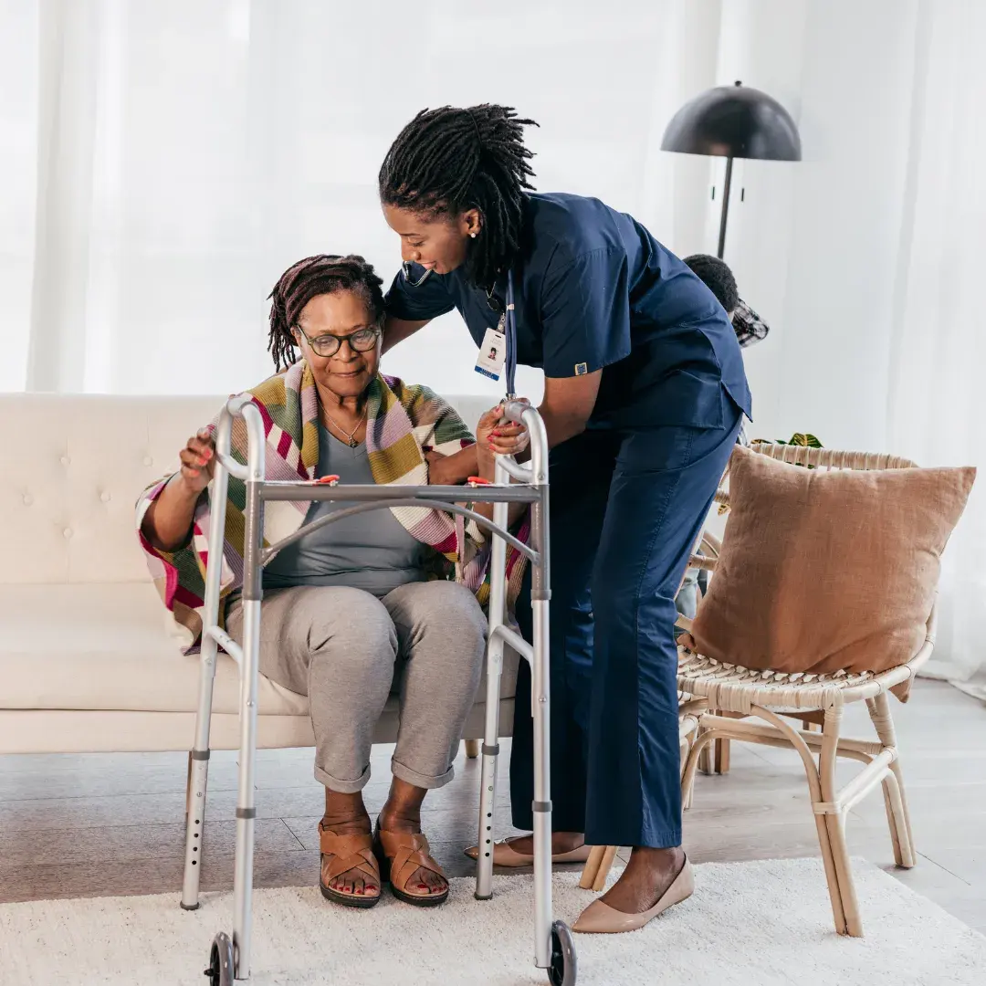 Caregiver supporting a senior client at home