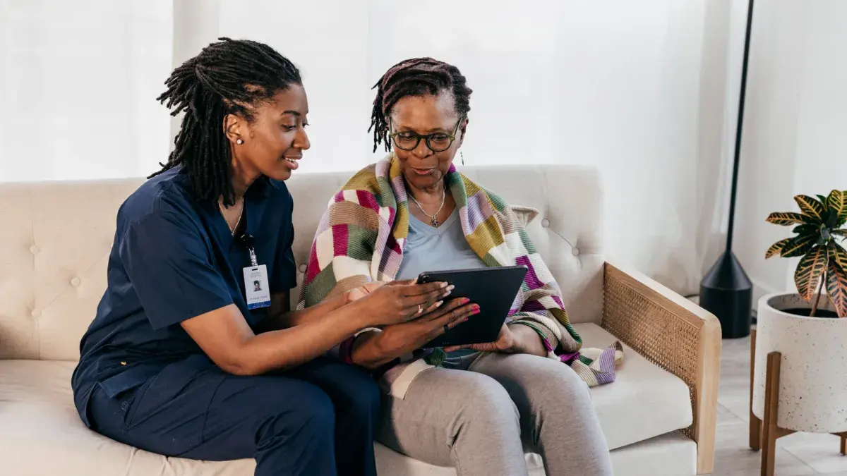Caregiver reviewing a personalized care plan with a client