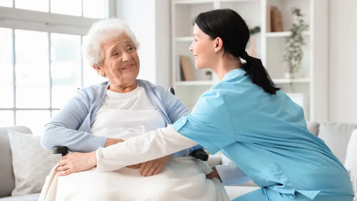 Caregiver assisting a senior client at home